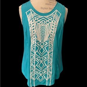 Green sleeveless embroidered accent blouse
